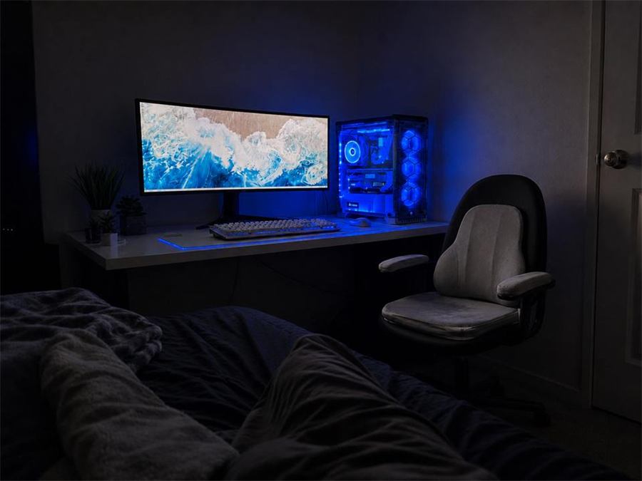 Phone shot of BackMod kit on black gaming chair in bedroom setup